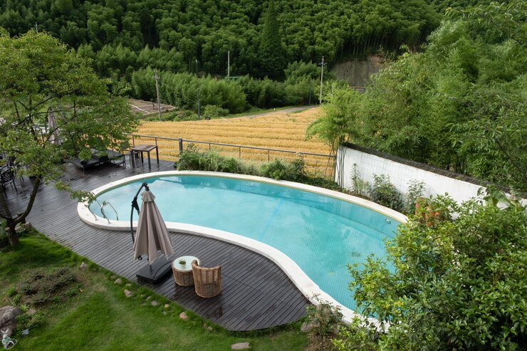 piscine hors-sol en béton - forme arrondie